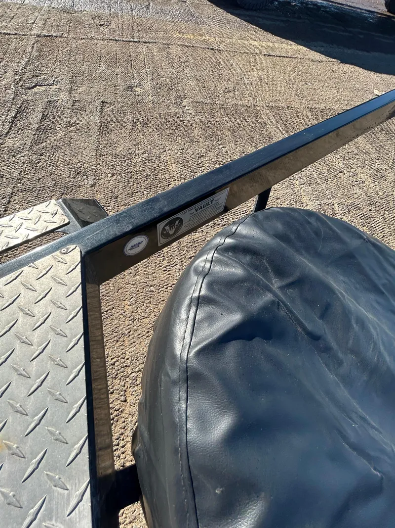 Slide: The Image of 2009 Champion 210 Elite boat on a lake with Mercury 300 engine. - 40