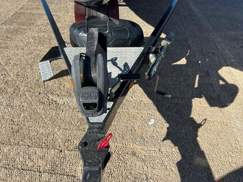 Slide: The Image of 2009 Champion 210 Elite boat on trailer, sunny day. - 41