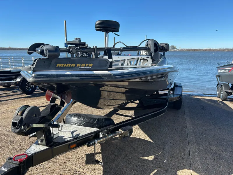 Slide: The Image of 2009 Champion 210 Elite boat trailer with diamond plate step detail. - 43