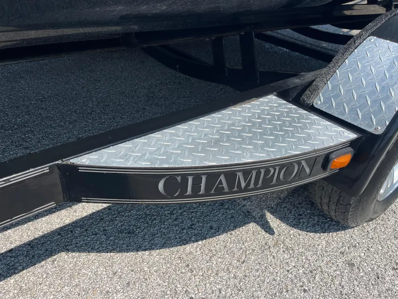 Slide: The Image of 2009 Champion 210 Elite boat trailer with spare tire and step platform. - 52