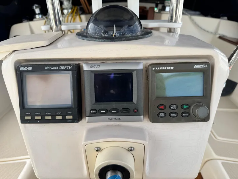 Slide: The Image of Control panel of a 1999 Island Packet 45 sailboat with navigation instruments. - 11