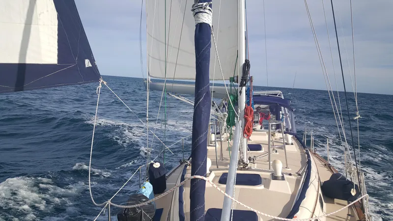 Slide: The Image of Sailing on a 1999 Island Packet 45 yacht in open sea, clear skies above. - 3