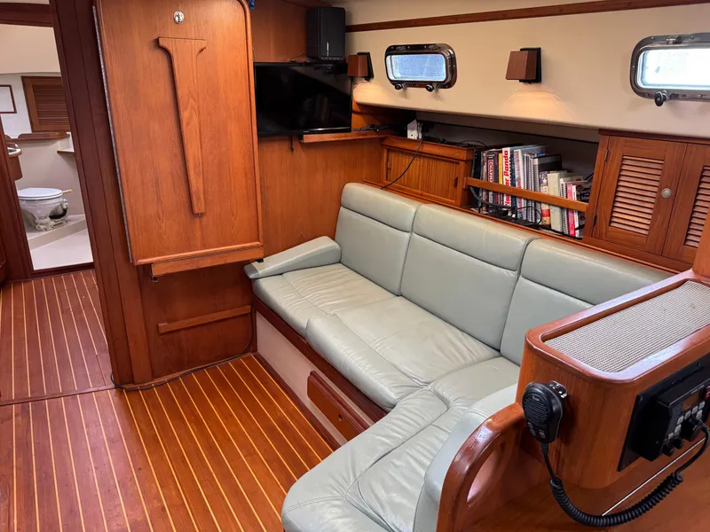 Slide: The Image of Interior of 1999 Island Packet 45 yacht with leather seating and wooden finishes. - 32