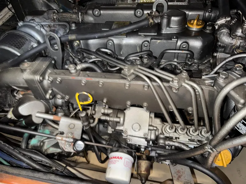 Slide: The Image of Engine of a 1999 Island Packet 45 sailboat, showcasing intricate mechanical components. - 47