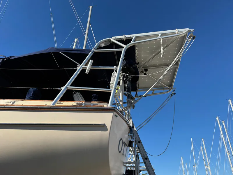 Slide: The Image of Island Packet 45 sailboat, 1999 model, with solar panels and blue sky background. - 5