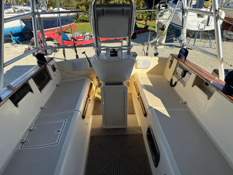 Slide: The Image of Cockpit of 1999 Island Packet 45 sailboat with seating and steering wheel. - 8