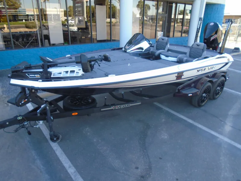 The Image of 2025 Vexus VXS20 boat on trailer, parked outdoors. - 1