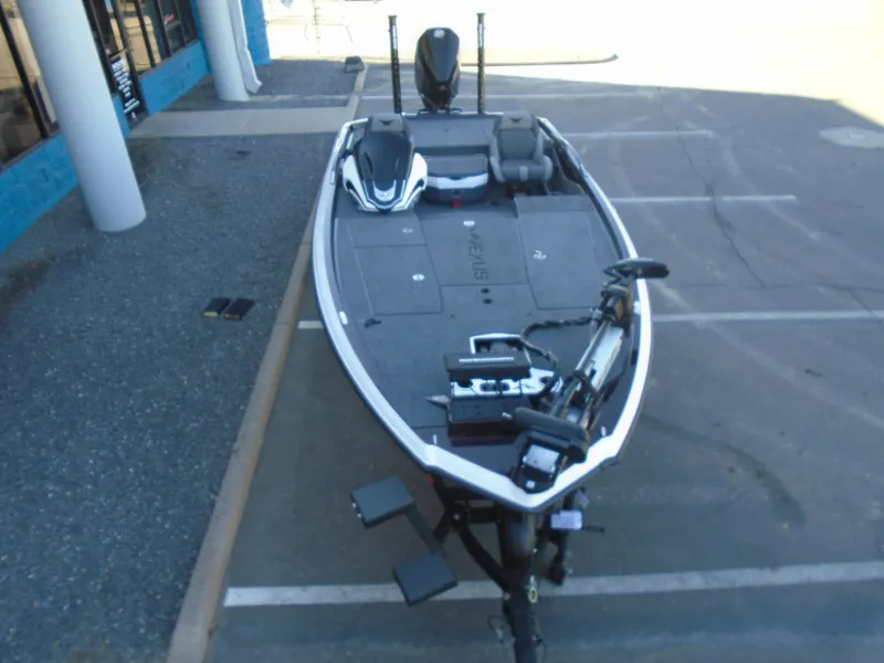 Slide: The Image of 2025 Vexus VXS20 fishing boat parked in a lot, featuring modern design and equipment. - 13