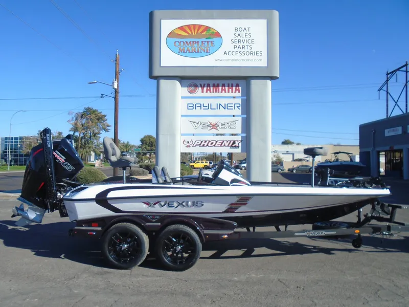 Slide: The Image of 2025 Vexus VXS20 boat displayed at Complete Marine dealership. - 22