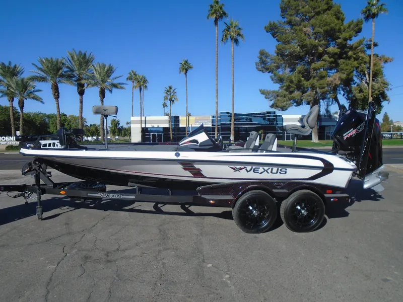 Slide: The Image of 2025 Vexus VXS20 boat on trailer, parked outdoors with palm trees in background. - 3