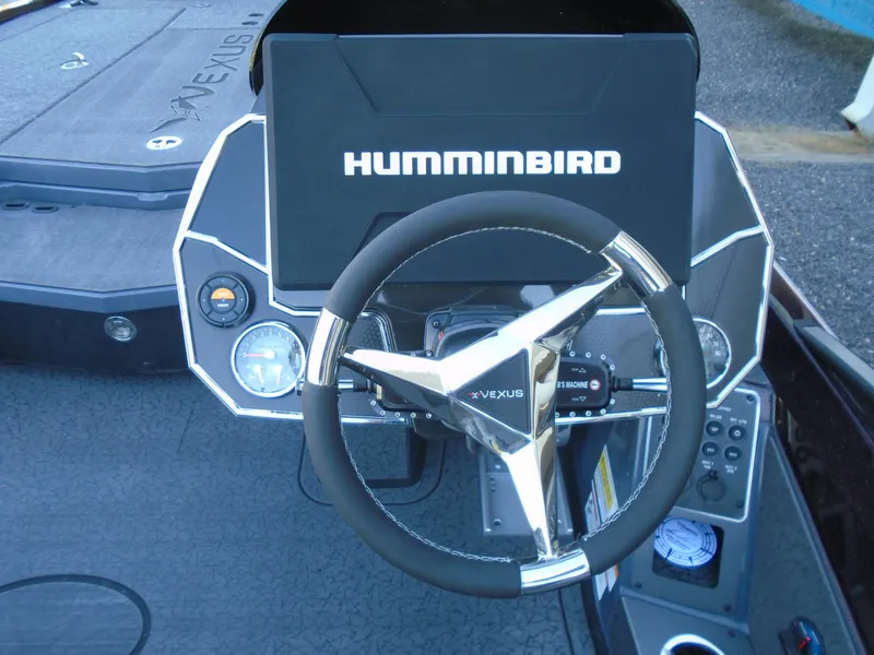 Slide: The Image of 2025 Vexus VXS20 boat dashboard with Humminbird display and steering wheel. - 8