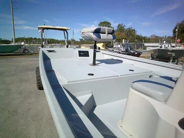 Slide: The Image of 2025 G3 18CCTDLX boat with seating, parked outdoors on a sunny day. - 4