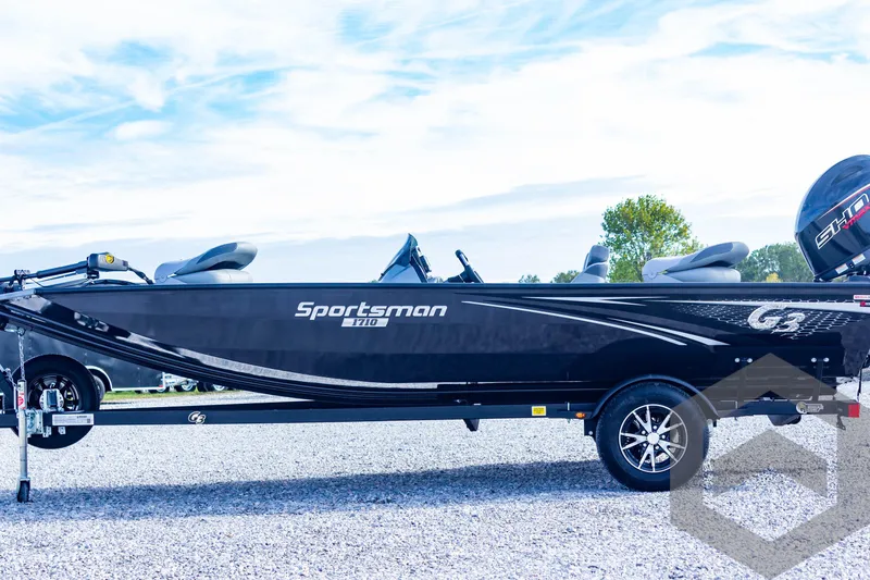 Slide: The Image of 2025 G3 Sportsman 1710 boat on trailer, side view, outdoors. - 11