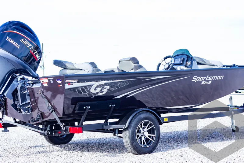 Slide: The Image of 2025 G3 Sportsman 1710 boat with Yamaha engine on gravel surface. - 13