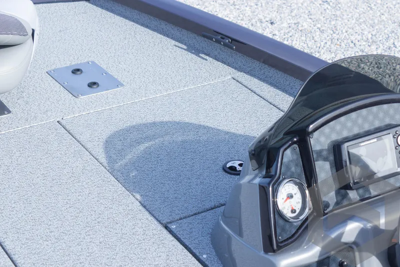 Slide: The Image of 2025 G3 Sportsman 1710 boat deck with control panel and seating. - 18