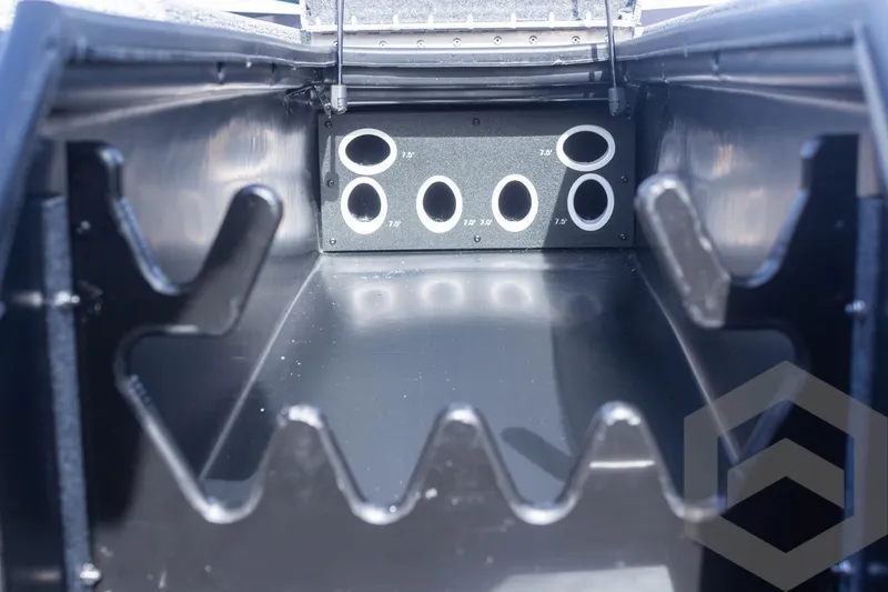 Slide: The Image of 2025 G3 Sportsman 1710 boat storage compartment with rod holders. - 24