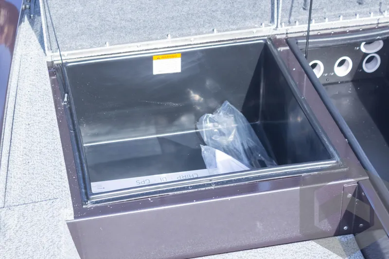 Slide: The Image of Open storage compartment in 2025 G3 Sportsman 1710 boat. - 25