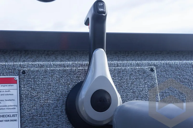 Slide: The Image of Throttle control lever on 2025 G3 Sportsman 1710 boat dashboard. - 37