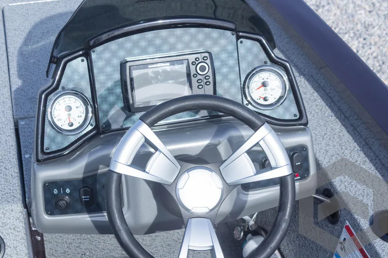 Slide: The Image of 2025 G3 Sportsman 1710 boat dashboard with steering wheel and gauges. - 48