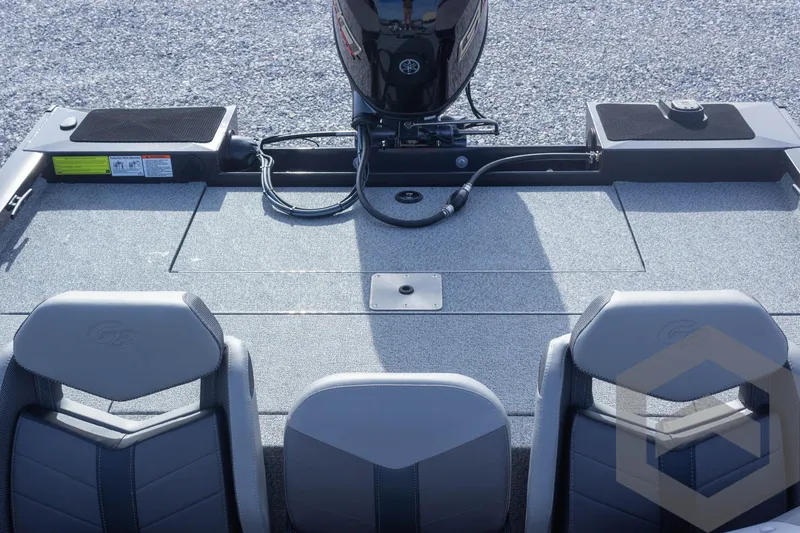 Slide: The Image of 2025 G3 Sportsman 1710 boat interior with seating and motor, top view. - 49