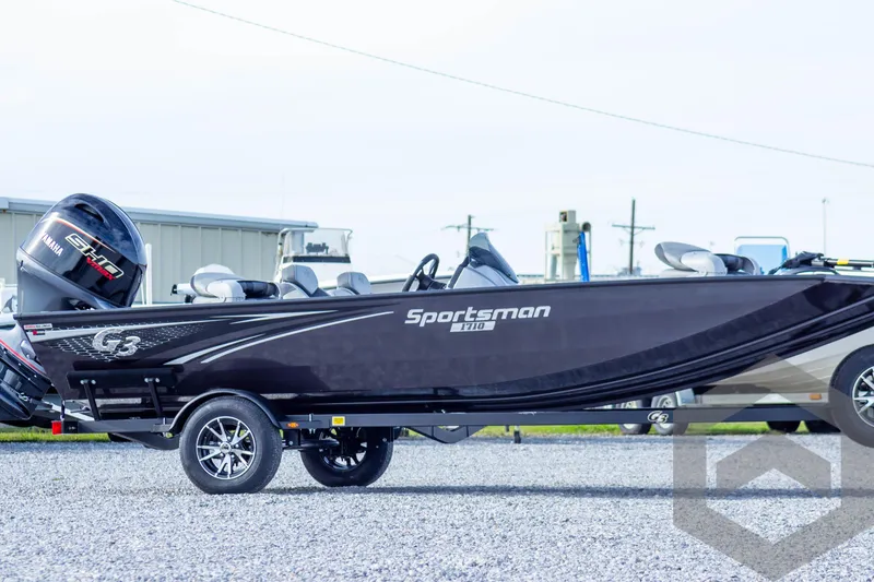 Slide: The Image of 2025 G3 Sportsman 1710 boat on trailer, side view, outdoors. - 8