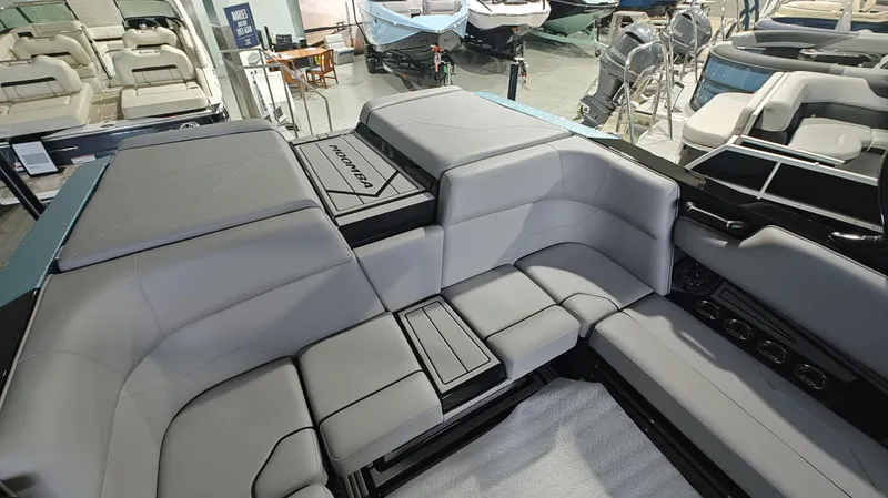 Slide: The Image of 2025 Moomba Max boat interior with spacious gray seating and modern design. - 10