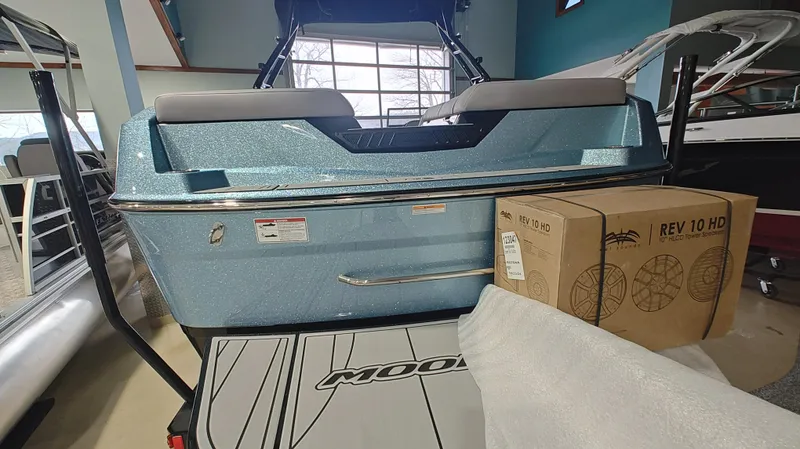 Slide: The Image of 2025 Moomba Max boat in showroom with REV 10 HD speaker box. - 15