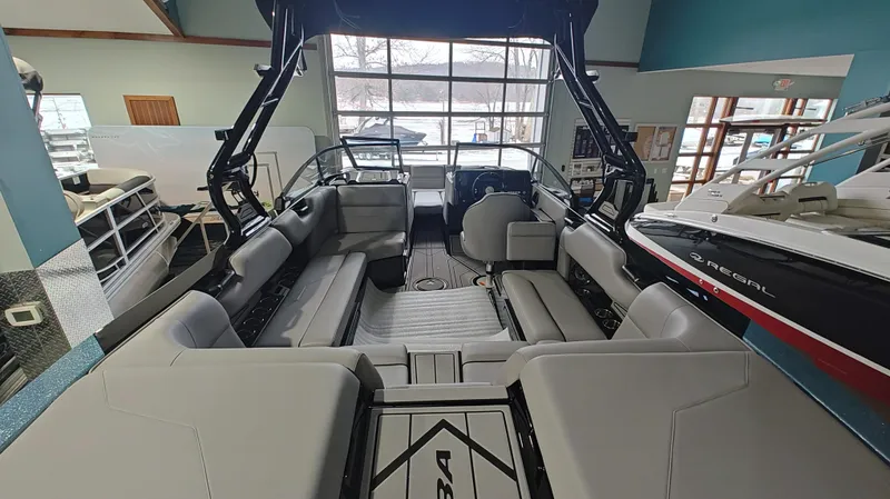 Slide: The Image of 2025 Moomba Max boat interior with spacious seating and modern design. - 16