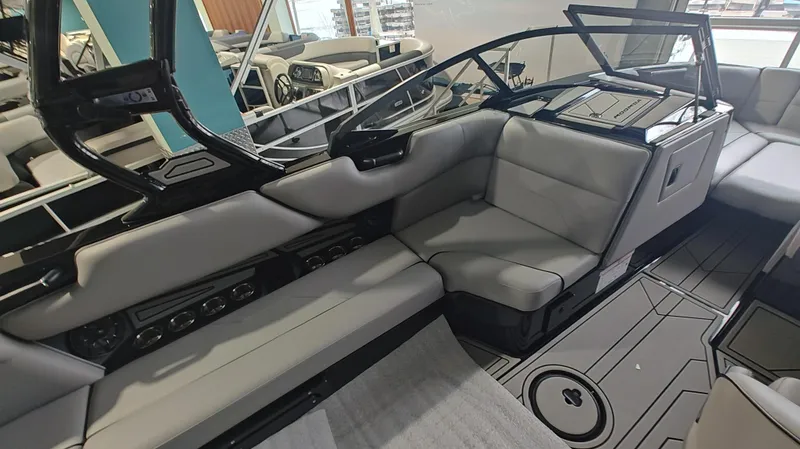 Slide: The Image of 2025 Moomba Max boat interior with sleek gray seating and modern design. - 18