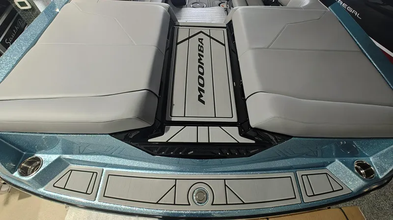 Slide: The Image of 2025 Moomba Max boat interior with sleek gray seating and stylish design. - 6