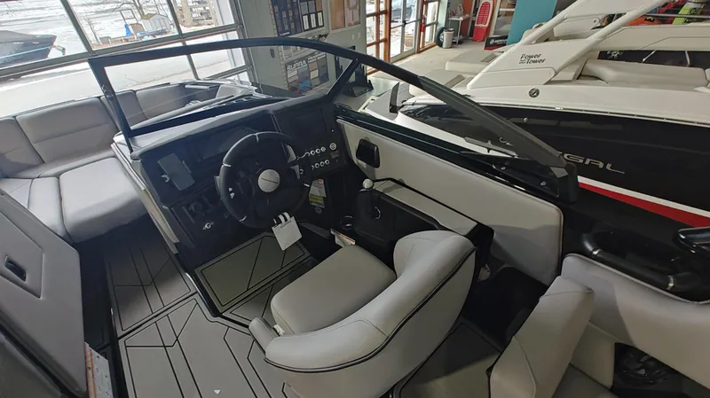 Slide: The Image of 2025 Moomba Max boat interior with modern steering and seating. - 7