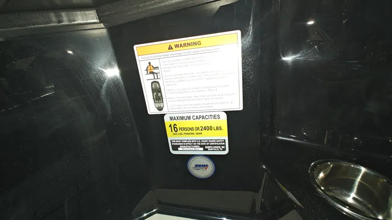 Slide: The Image of Warning label on 2025 Moomba Max boat, capacity 16 persons or 2400 lbs. - 8