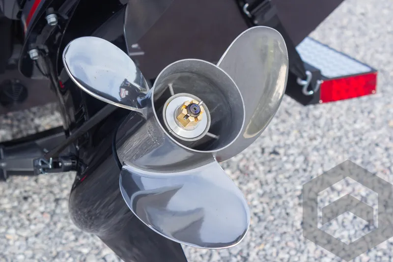 Slide: The Image of Close-up of a 2025 G3 Sportsman 1910 boat propeller on gravel surface. - 17