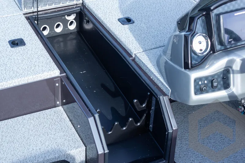 Slide: The Image of 2025 G3 Sportsman 1910 boat interior with rod storage and control panel. - 29