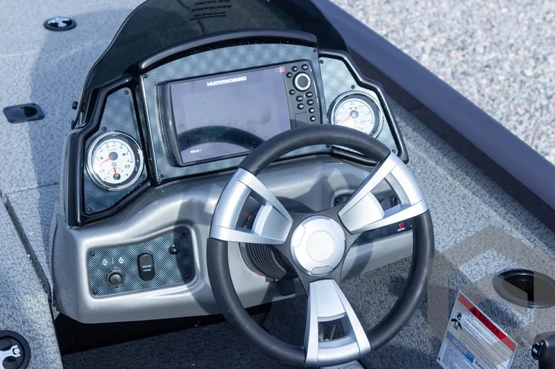 Slide: The Image of 2025 G3 Sportsman 1910 boat dashboard with steering wheel and control panel. - 42