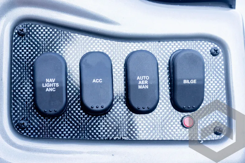 Slide: The Image of Control panel of 2025 G3 Sportsman 1910 boat with labeled switches. - 49