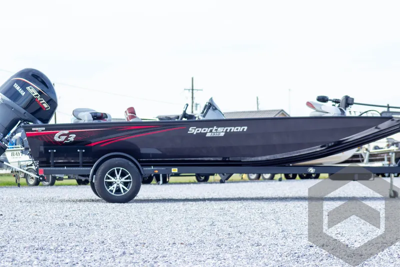 Slide: The Image of 2025 G3 Sportsman 1910 boat on trailer, side view, outdoors. - 9