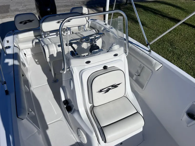 Slide: The Image of 2021 Glasstream 180 CC boat interior with steering console and seating, Mercury 115 engine. - 10