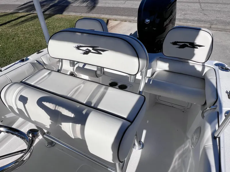 Slide: The Image of 2021 Glasstream 180 CC boat interior with white seating and Mercury engine. - 11