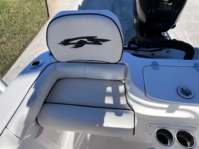 Slide: The Image of 2021 Glasstream 180 CC boat interior with white seating and Mercury engine. - 12