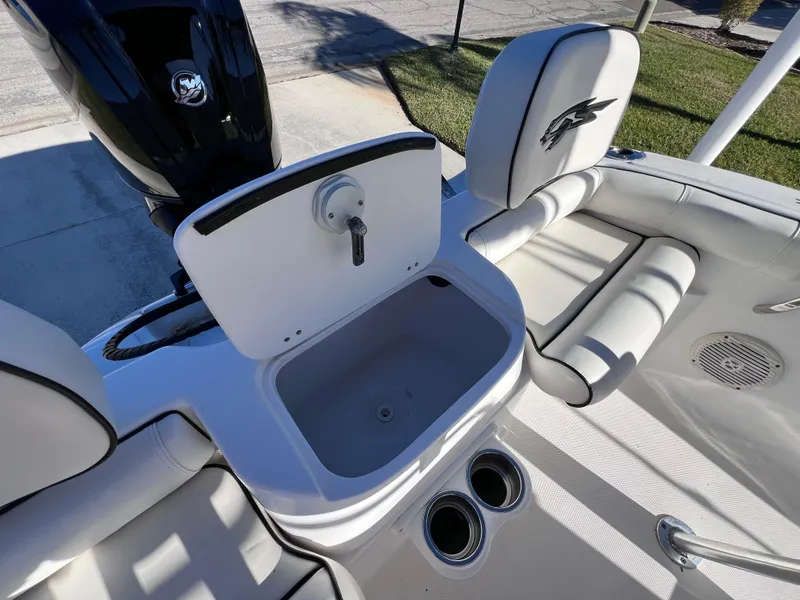 Slide: The Image of 2021 Glasstream 180 CC boat interior with open storage compartment and cup holders. - 14