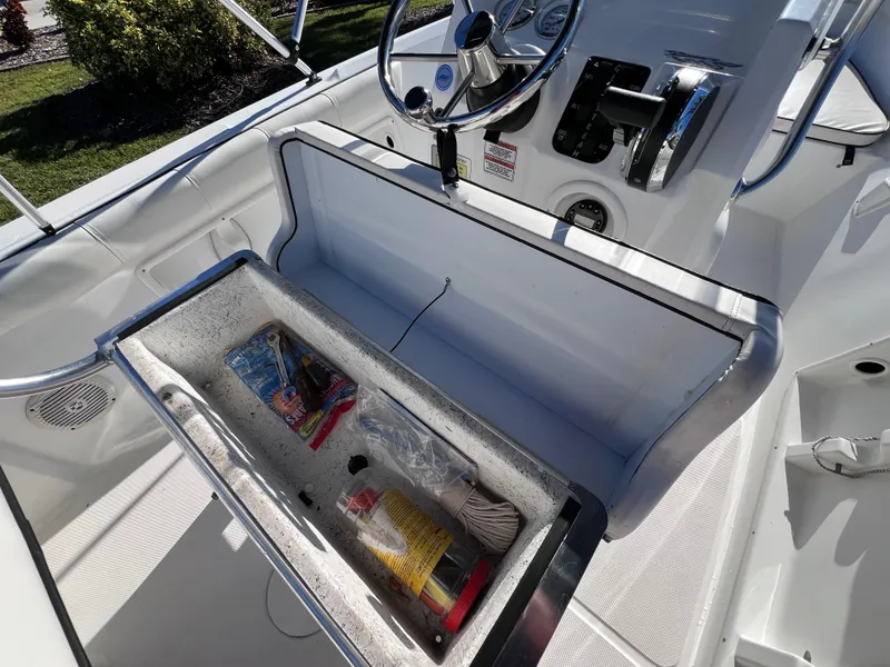 Slide: The Image of 2021 Glasstream 180 CC boat interior with storage compartment open, showcasing various items. - 16