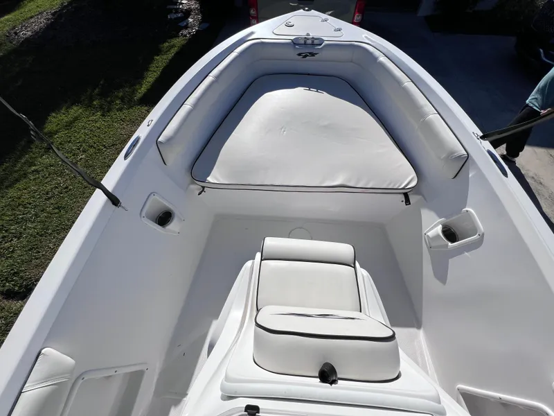 Slide: The Image of 2021 Glasstream 180 CC boat interior with white seating and storage compartments. - 17