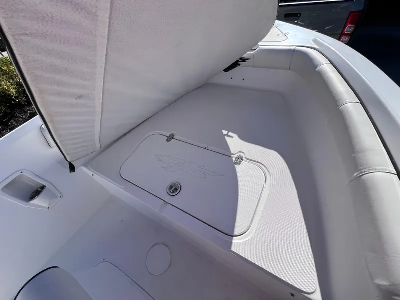 Slide: The Image of 2021 Glasstream 180 CC boat interior storage compartment, open lid, white upholstery. - 19