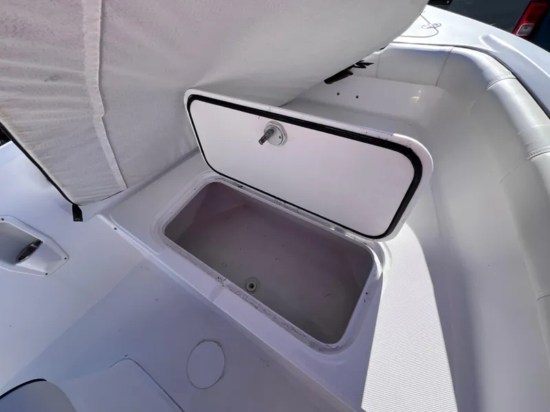 Slide: The Image of 2021 Glasstream 180 CC boat storage compartment, open and empty, showcasing interior space. - 20