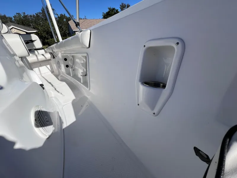 Slide: The Image of 2021 Glasstream 180 CC boat interior, featuring white seating and cup holders. - 22