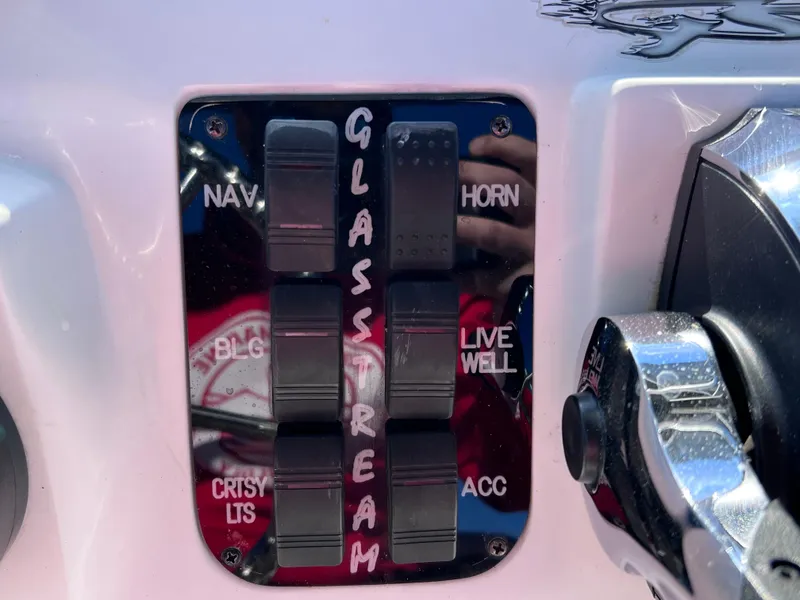 Slide: The Image of Control panel of 2021 Glasstream 180 CC boat with labeled switches. - 27