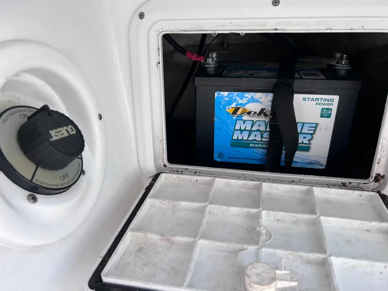 Slide: The Image of 2021 Glasstream 180 CC boat battery compartment with Deka Marine Master battery. - 29