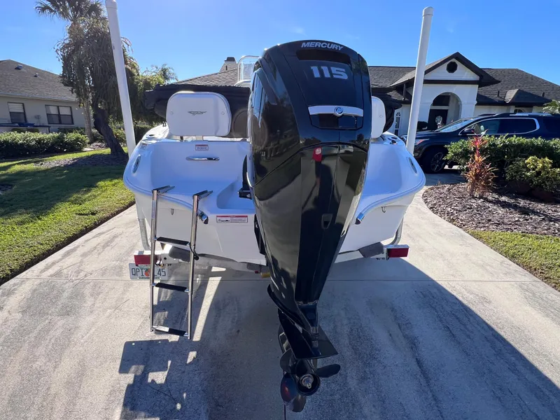 Slide: The Image of 2021 Glasstream 180 CC boat with Mercury 115 engine, parked in driveway. - 4
