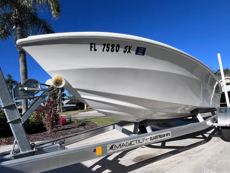 Slide: The Image of 2021 Glasstream 180 CC boat on trailer, sunny day, palm trees in background. - 7